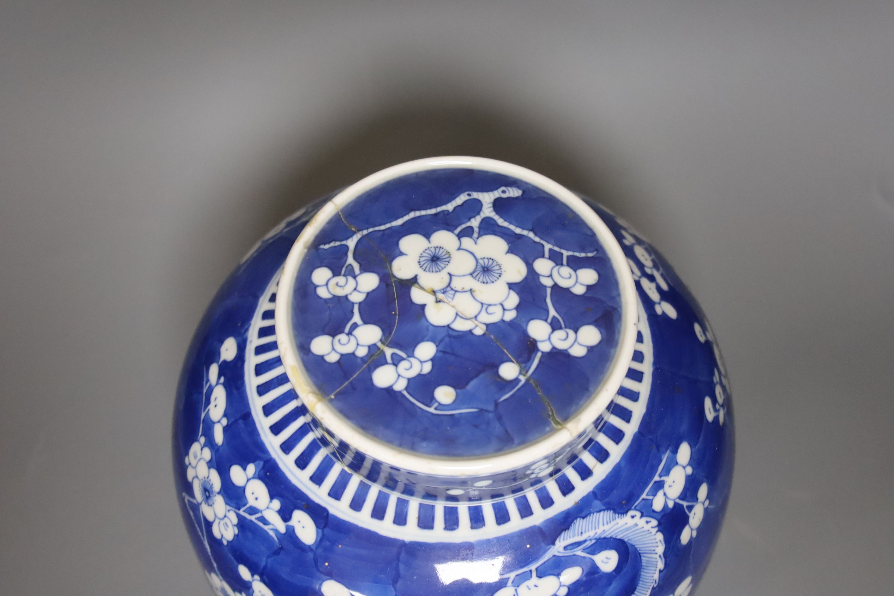 An early 20th century Chinese blue and white prunus jar and cover, height 26cm